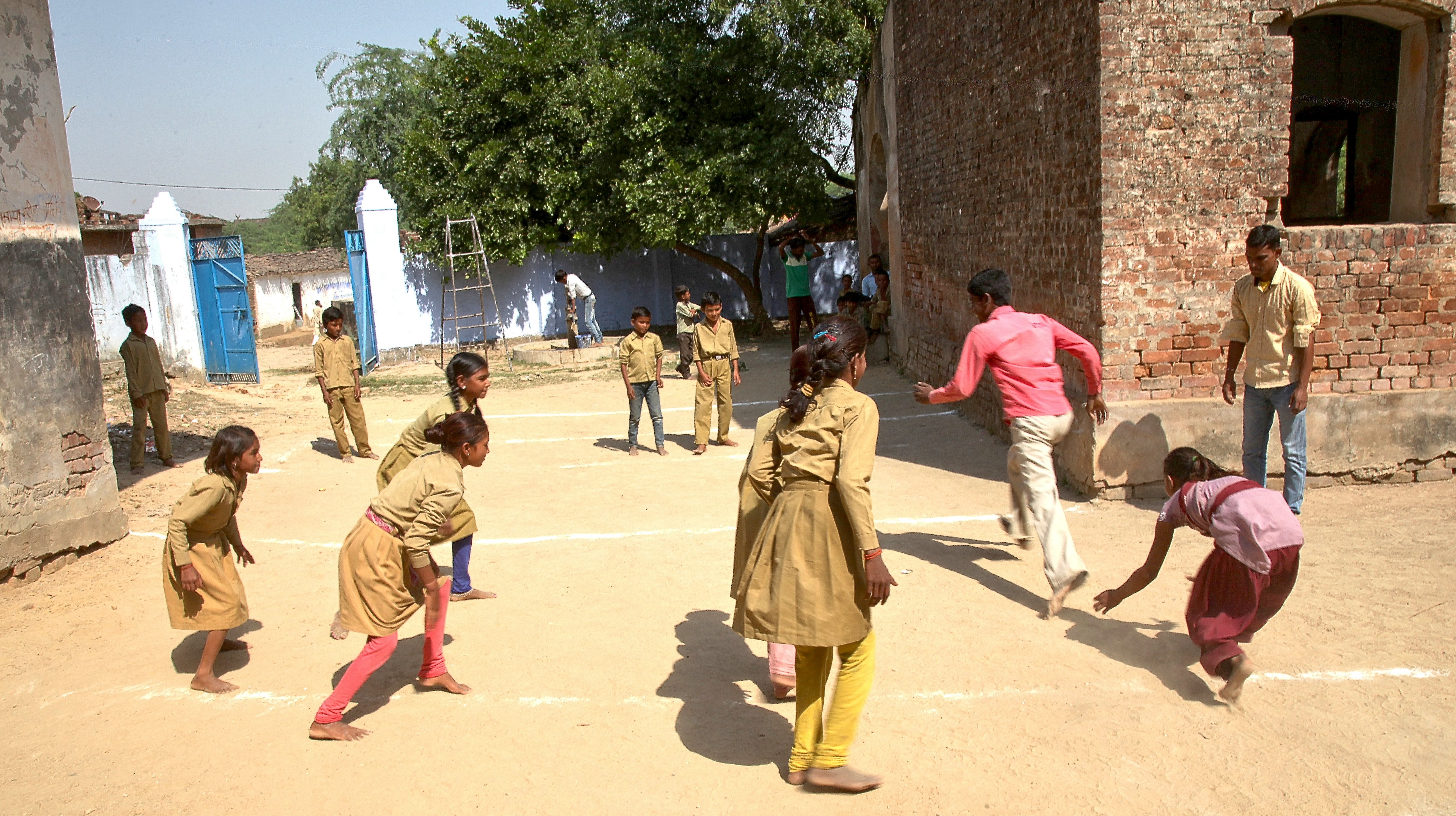Both boys and girls joining sports activities in schools
